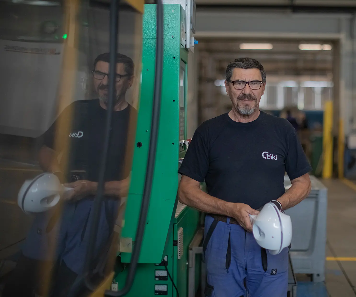 mechanical hand and production worker